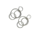 three circles intertwined hanging from a handmade earwire. Sterling silver 