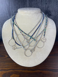multiple choker necklaces showing the clasps that have a large circle and handmade clasp