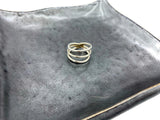 sterling silver three wires make up one ring on the front you see three rings and on the back it is one whole ring